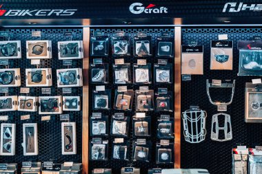 NAKHON PATHOM,THAILAND-JANUARY 7, 2023 : Motorcycling accessories and spare parts of Honda Cub Motorcycle classic collection on display for sale at CUB House Nakhon Pathom Honda x Greyhound Coffee.