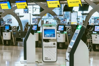 BANGKOK-THAILAND, FEBRUARY 20,2023 : Automated self check-in or self service machine at Suvarnabhumi International Airport. Innovation at the service of people, automation, staff reduction concept.