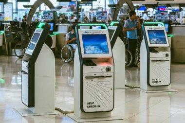 BANGKOK-THAILAND, FEBRUARY 20,2023 : Automated self check-in or self service machine at Suvarnabhumi International Airport. Innovation at the service of people, automation, staff reduction concept.