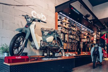 NAKHON PATHOM,THAILAND-JANUARY 7, 2023 : View of Honda Super Cub C 125 Motorcycle classic 125cc. collection on display for sale at CUB House Nakhon Pathom Honda x Greyhound Coffee. Concept retro.