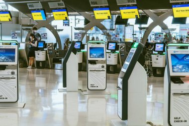 BANGKOK-THAILAND, FEBRUARY 20,2023 : Automated self check-in or self service machine at Suvarnabhumi International Airport. Innovation at the service of people, automation, staff reduction concept.