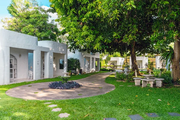 stock image KANCHANABURI-THAILAND,JUNE 30,2023 : Beautiful exterior view of modern resort in loft style or decoration of cozy lodge in modern style at Villa La Flora. Beautiful Resort or Hotel exterior in garden.