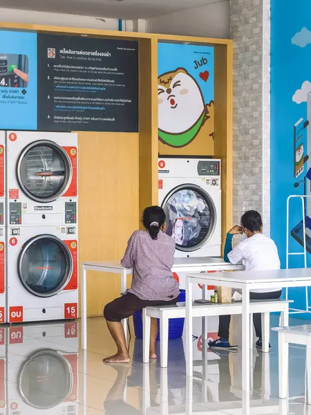 stock image KANCHANABURI, THAILAND-FEBRUARY 6,2024 : View of laundry service shop with automatic washer dryer available to general customers 24 hours a day at Otteri wash and dry. Cloth cleaning business concept.