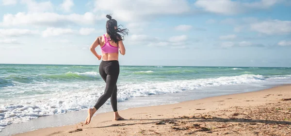 stock image Fitness Girl working out on the beach making exercise.