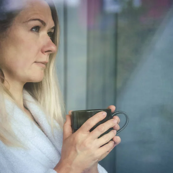Woman Elegant Robe Drinking Coffee Hotel Room Standing Window Face — Zdjęcie stockowe