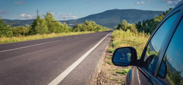 Car Traveling Mountain Road Blue Sky — стоковое фото