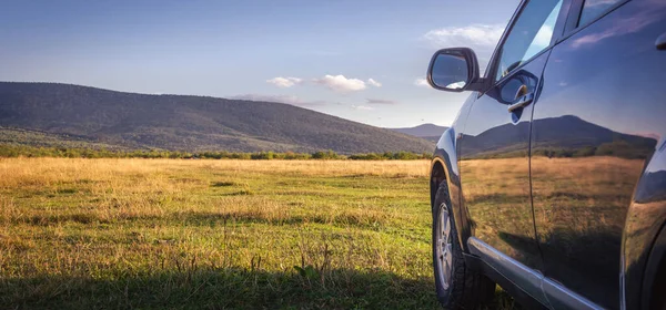 stock image car for traveling with a mountain road. Blue sky