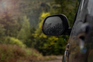 car for traveling with a mountain road. Dramatic sky