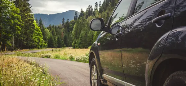 Woman in white bathrobe lying on sofa and relaxing with orange cocktail at the roof of hotel