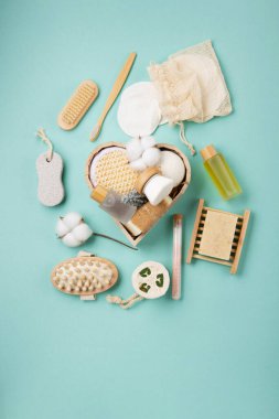 Natural eco friendly beauty skin care products concept. Zero waste bathroom, spa accessories on green mint background. Eco friendly self care package for family and friends for thankgiving, christmas, mothers day, valentines day.