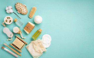 Natural eco friendly beauty natural skin care products concept. Zero waste bathroom and spa accessories on green mint background. Handmade soap bars 