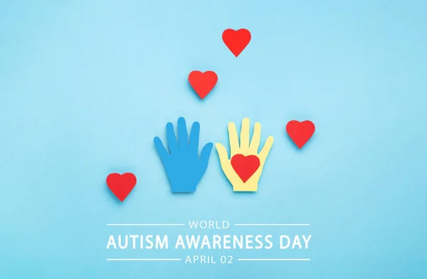 World Autism Awareness Day or month concept. Creative design for April 2. Colorful hands on blue background, symbol of awareness for autism spectrum disorder.