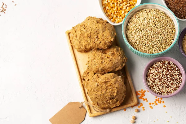 Gluten free, Healthy eating, dieting, balanced food concept. Bread gluten-free, millet, quinoa, polenta, buckwheat, rice, chickpea on white background, copy space.