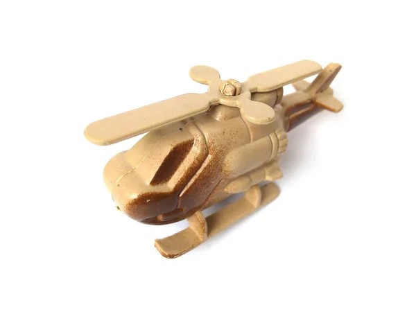 Helicopter toy isolated on white background. Close up of brown color plastic toy, kids toy.