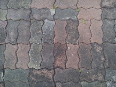 Beton tuğlalar üzerindeki leke zemin dokusu arkaplanı.