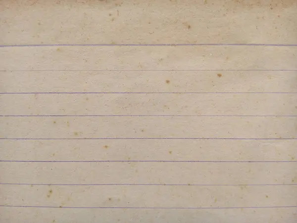 Grunge lined paper texture background. Close up of stain on old notebook paper sheet.