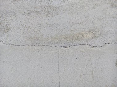 Çatlak beton zemin dokusu. Yeni beton zemin yüzeyinin üst görünümü.
