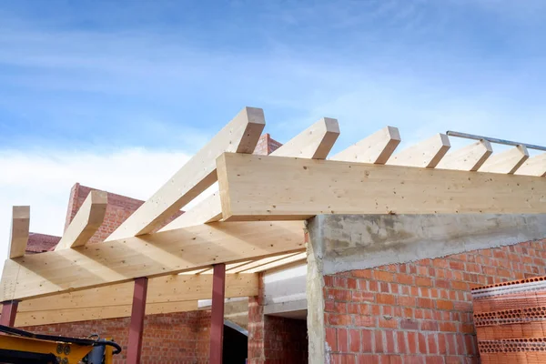 Construction of a natural wooden roof, structure with sustainable ecological material.