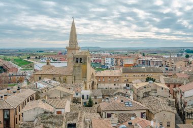 View of the historic town of Olite in Navarra, Spain, with a castle visited by tourists.
