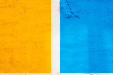 A background painted in two halves of yellow and blue, separated by a white line.