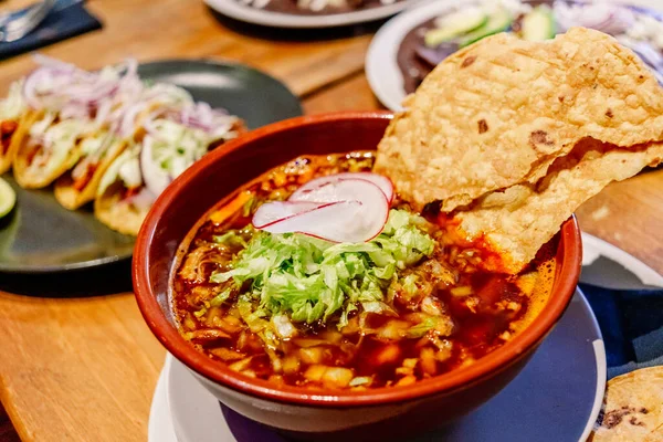 stock image Chicken and corn soup with Mexican lettuce, a traditional pozole.