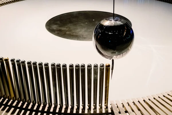 stock image Swinging ball of the Eddy pendulum in a science demonstration.