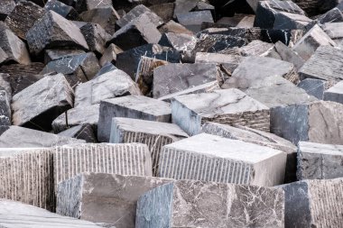 Large granite blocks prevent waves from invading inland due to rising sea levels.