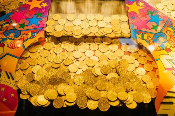 Golden tokens in a gaming machine in a casino.