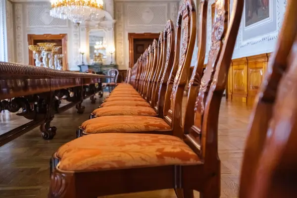 Long classic hardwood table and chairs for official meetings in a palace in Copenhagen.