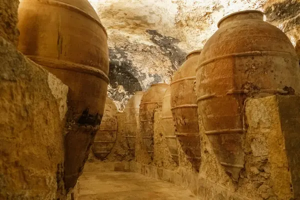 stock image Centuries-old large clay jars for storing wine or cereal, in underground tunnels.