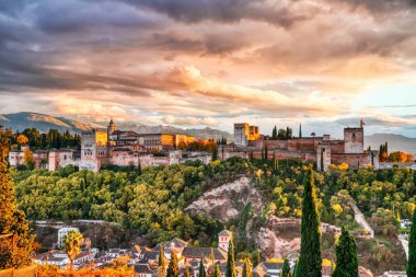 Alhambra Fortress Aerial View at Sunset with Amazing Clouds, Granada, Andalusia, Spain clipart