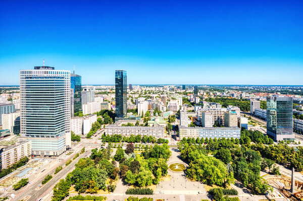 Warsaw City Aerial View with Modern Skyscrapers during a Sunny Day, Poland