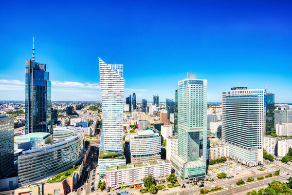 Warsaw City Aerial View with Modern Skyscrapers during a Sunny Day, Poland