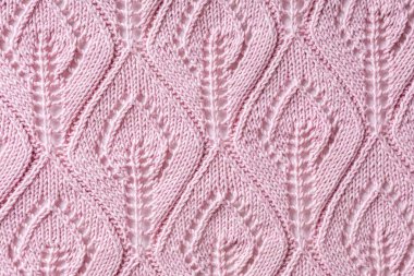 El yapımı, pembe örgü yün yaprak şekilli arka plan. Örgü kıyafetlerinin en üst görünümü