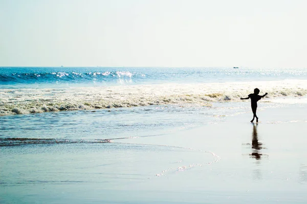 stock image Young boy dancing on the beach