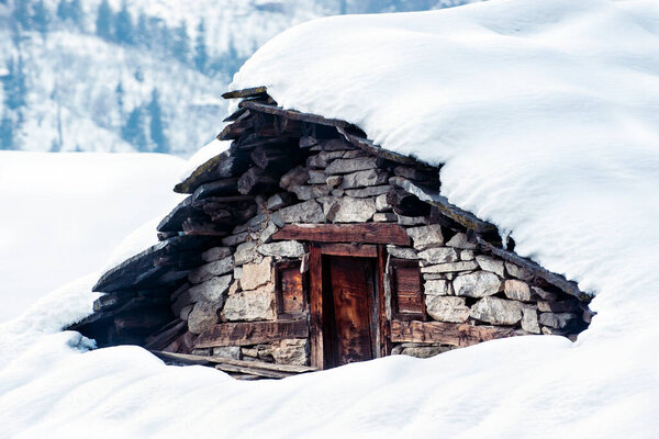 Snow covered local house in India