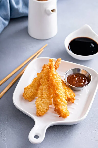 Tempura shrimp single serving on a plate served with sweet and sour sauce and soy sauce, appetizer idea