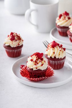 Red velvet mini cupcakes with cream cheese frosting, homemade dessert idea for Valentines day