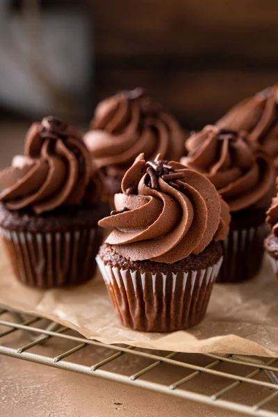 Dark chocolate mini cupcakes with chocolate ganache frosting and sprinkles