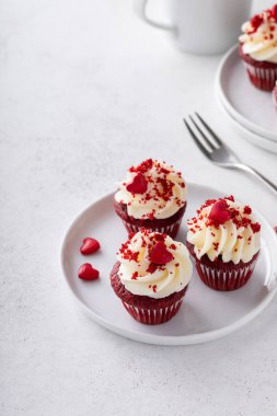 Red velvet mini cupcakes with cream cheese frosting, homemade dessert idea for Valentines day