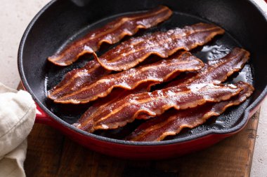 Turkey bacon cooked on a cast iron pan ready to eat