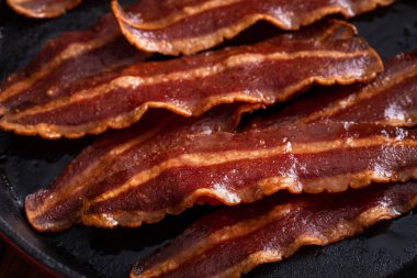 Turkey bacon cooked on a cast iron pan ready to eat