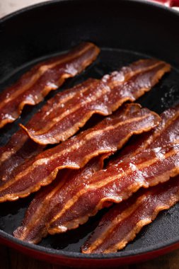 Turkey bacon cooked on a cast iron pan ready to eat