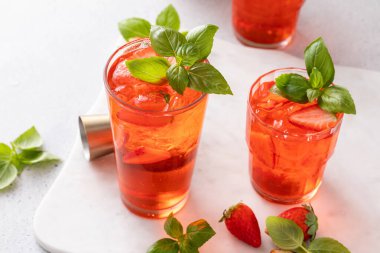 Strawberry basil cocktail or mocktail, cold refreshing summer drink