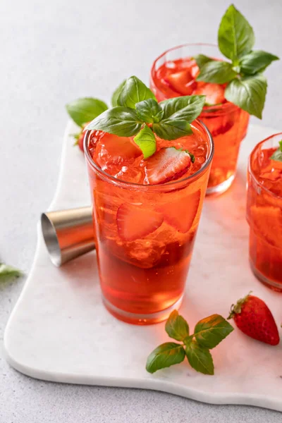 Strawberry basil cocktail or mocktail, cold refreshing summer drink