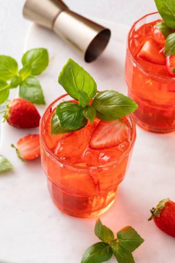 Strawberry basil cocktail or mocktail, cold refreshing summer drink