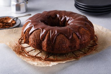 Chocolate bundt cake drizzled with chocolate ganache glaze
