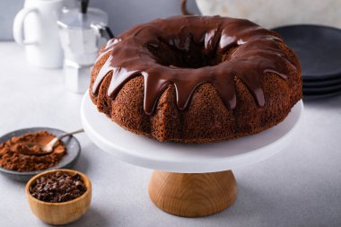 Chocolate bundt cake drizzled with chocolate ganache glaze