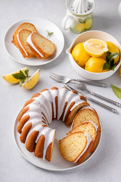 Lemon Bundt Cake Drizzled Powdered Sugar Glaze Topped Lemon Zest — 스톡 사진