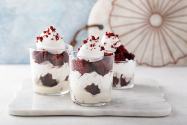 Red velvet trifle or parfait with cream cheese mousse and whipped cream, dessert in a glass idea